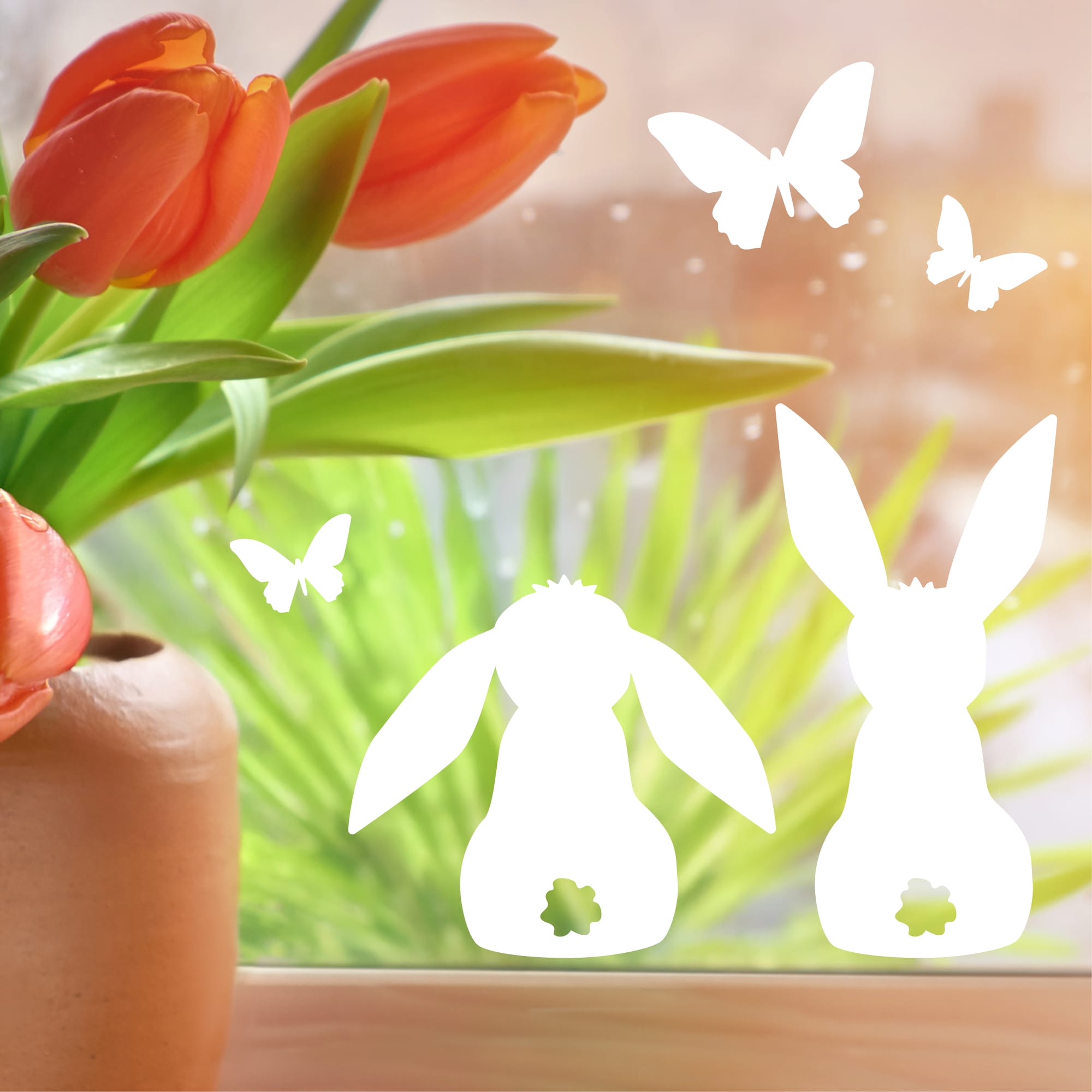 Auf dem Bild ist das Produkt: Fensteraufkleber Frühling Ostern drei Hasen Blümchen Schmetterlinge weiß WIEDERVERWENDBAR 23 Aufkleber im SetFensterbild Fensterdeko zum Preis von €8.9 abgebildet.